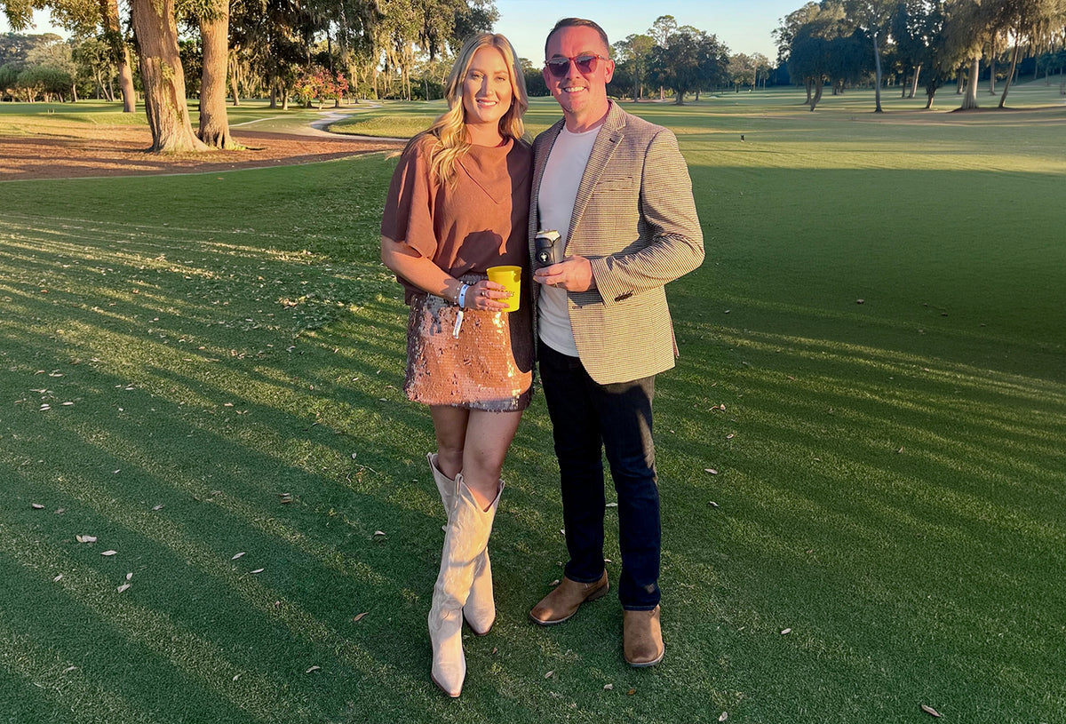 Gloozie golf can coolers featured by a couple on a golf course