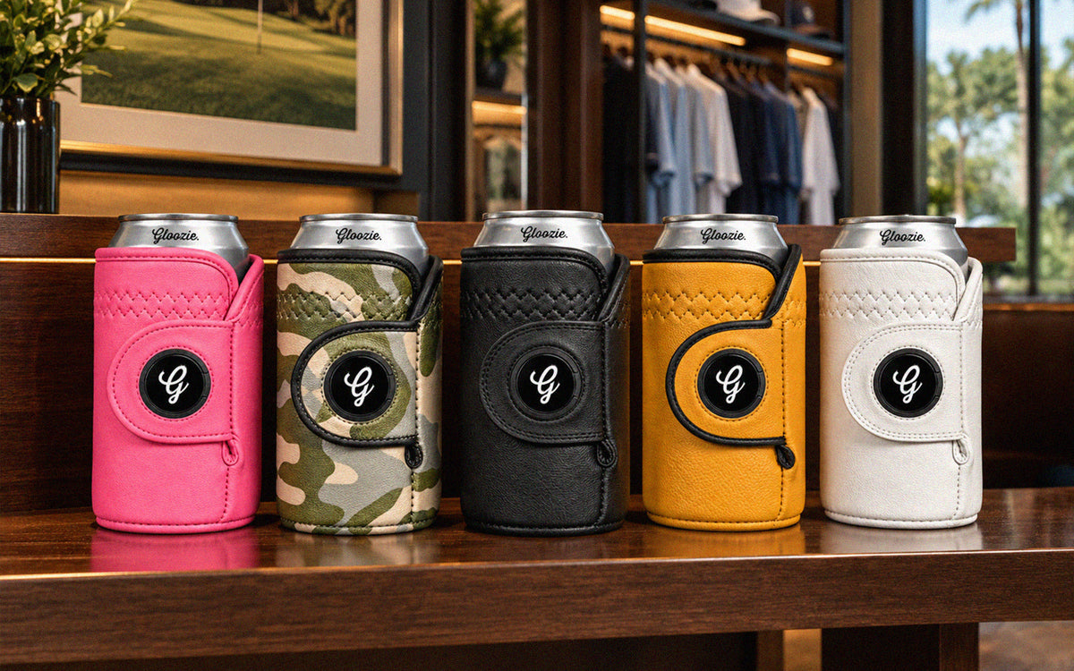 Gloozie golf coozies in pink, camouflage, black, gold, and white displayed together